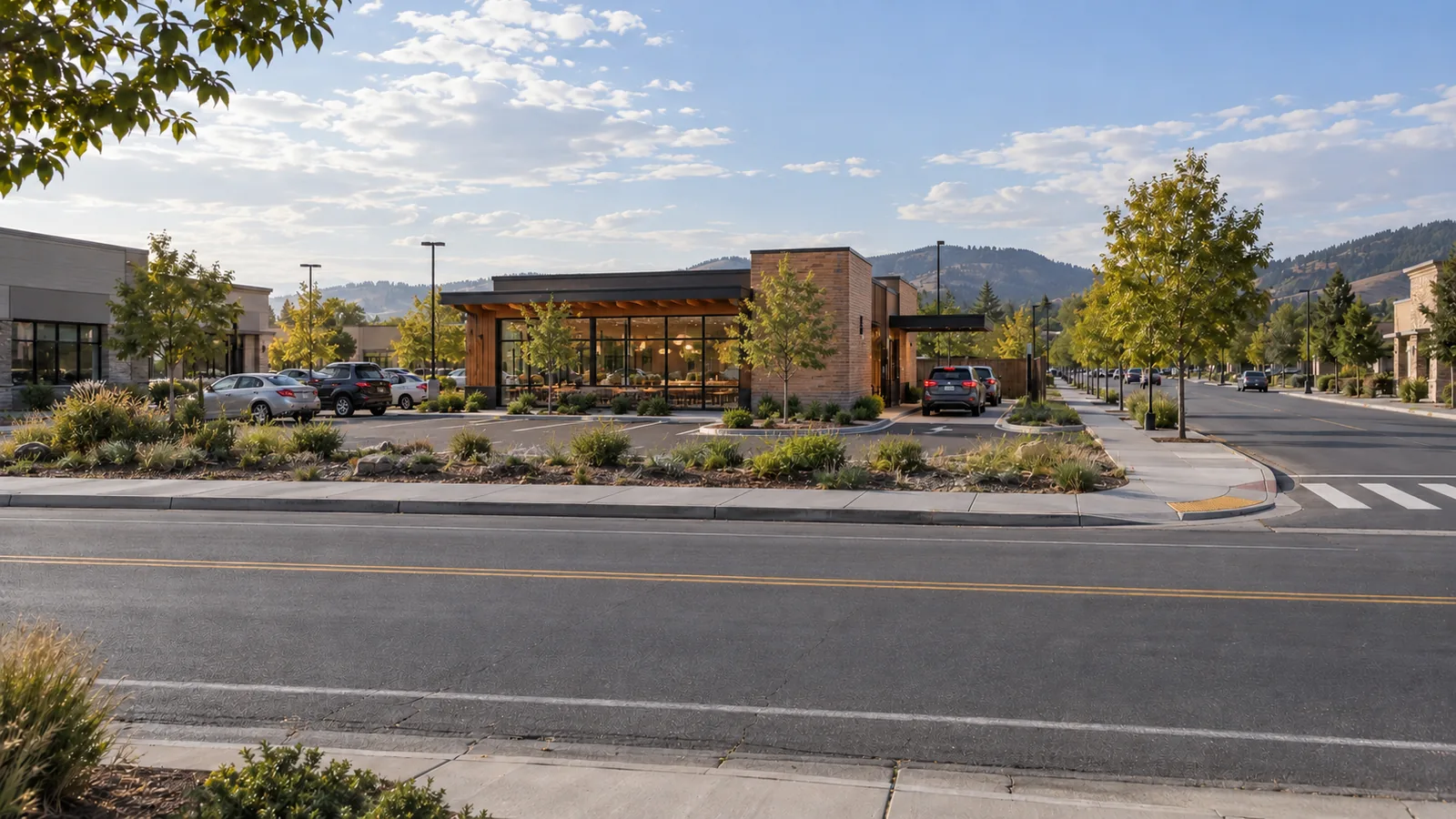 The same street frame with a single-story restaurant and a contained drive-through lane